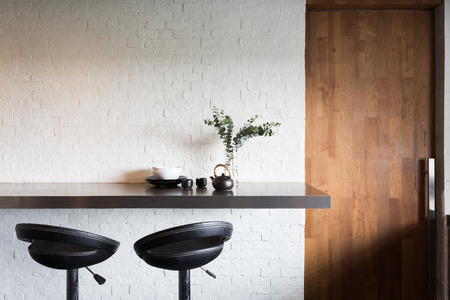 loft interior with white brick wall and natural light.の写真素材