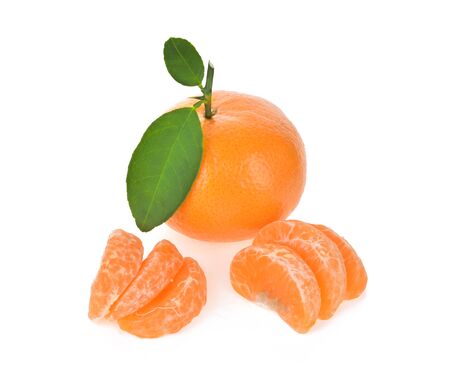 Tangerines with leaves and slices on white backgroundの写真素材