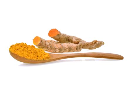 Turmeric roots with turmeric powder on white backgroundの写真素材