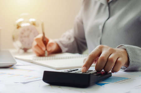business woman in tax deduction planning concept Calculate tax deduction in 2022, businessman...