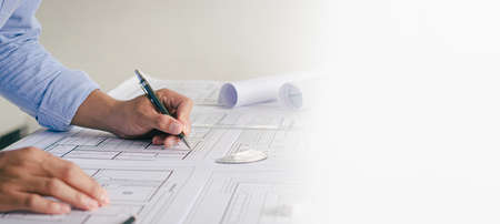 Close-up view of an engineer's plan drafting an architect's plan. along with the tools and equipment placed on the table Successful work conceptの写真素材