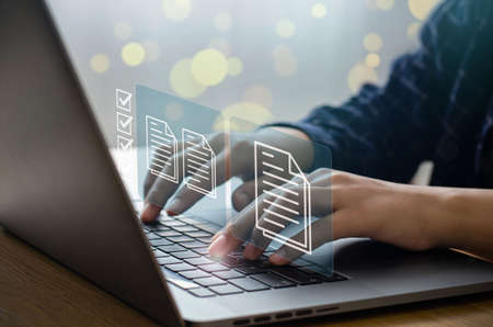 business man who uses a computer to manage documents document management concept digital document online document database and digital file storage systems, record-keeping software database technologyの写真素材