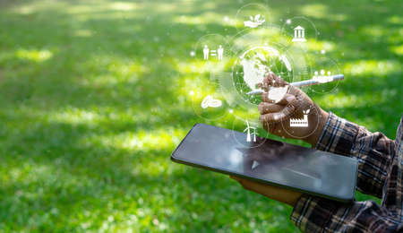 Environmental energy reduction concept. CO2 emissions with global warming icons. with business men typing computersの写真素材