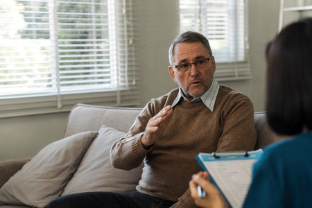 Nurses check medical and nursing follow-up information with health examination documents.の写真素材