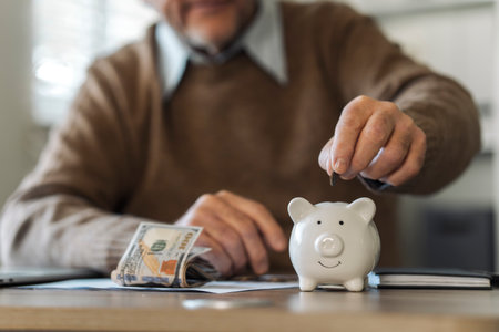 Retirement Saving Investment, Old Man Putting Coins in Piggy Bank, Retirement Planning Conceptの写真素材