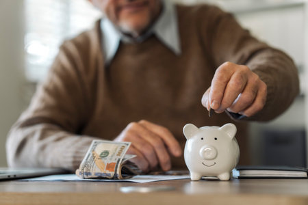 Retirement Saving Investment, Old Man Putting Coins in Piggy Bank, Retirement Planning Conceptの写真素材