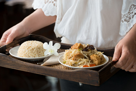 Chef serving brown rice and vegetarian food.Healthy food menu ,delicious and good for health