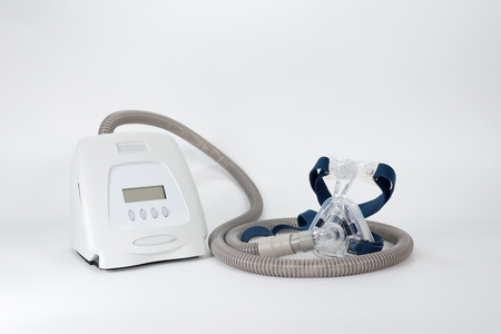 Full components of Cpap system ,isolated white background.
Cpap Continuous positive airway pressure system includes of main unit,mask,tube and headgear.の写真素材