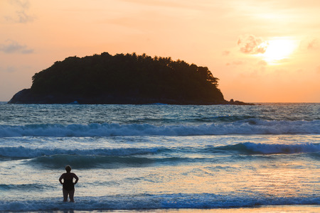 Silhouette of woman standing against big wave on golden beach at sunset.
Tranquil of wonderful beach returns a freedom to your soul ,travel destination,phuket.の写真素材