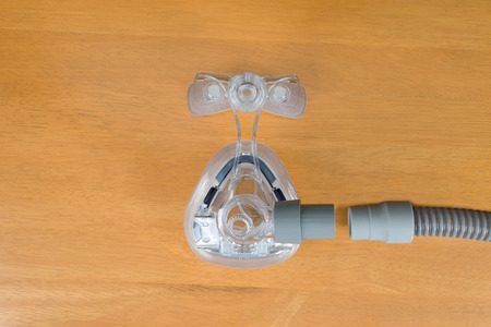 Pair of CPAP mask and tubing,flat lay.
Parts of Cpap machine for obstructive sleep apnea therapy.の写真素材