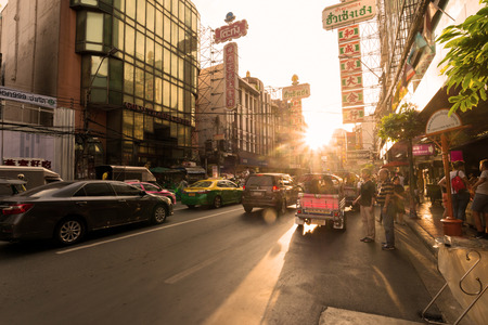 BANGKOK-JULY 15,2017:Yaowarat china town one of the famous tourist destination of Thailand.
Sunset on the golden  street  at the busy time and traffic.のeditorial素材