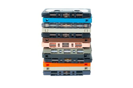 Obsolete technology of audio recording and playback format audio cassette tape isolated on white background with clipping path. Cassette tapes stack tower .の写真素材