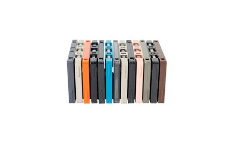 Obsolete technology of audio recording and playback format audio cassette tape isolated on white background with clipping path. Cassette tapes stack leaning in horizontal line .の写真素材