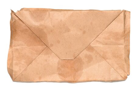 Close up bottom of  used kraft paper bag with oil slick and pattern in flat lay,top view .Brown paper bag texture,isolated on white background .の写真素材