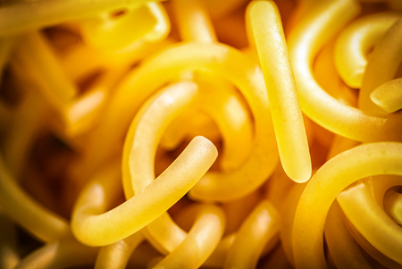 Vermicelli close-up, macro, yellow twisted raw tasty and healthyの写真素材