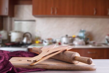 wooden surface and inventory on the background of the kitchenの写真素材
