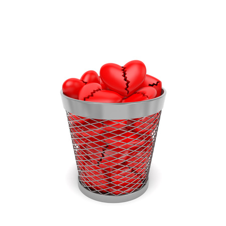 Broken hearts with crack in the trash bin wastebasket as symbol of divorce, rift break in romantic relationship between lovers lovebirds or cardiac diseaseの写真素材