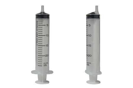Plastic syringe isolated on white backgroundの写真素材