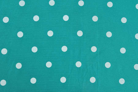 White dot pattern over green backgroundの写真素材