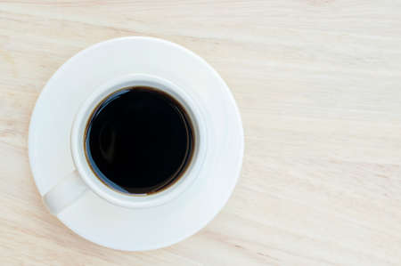 Hot black coffee on wood floorの写真素材