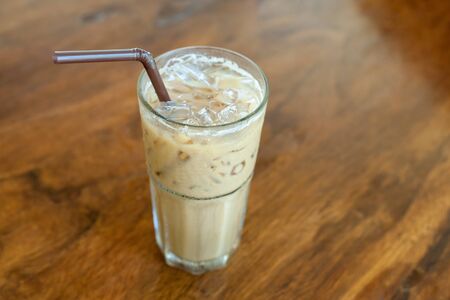 Glass Of Cold Coffee On Woodの写真素材
