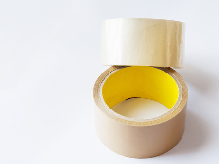 two roll of brown sticky tape isolated on white backgroundの写真素材
