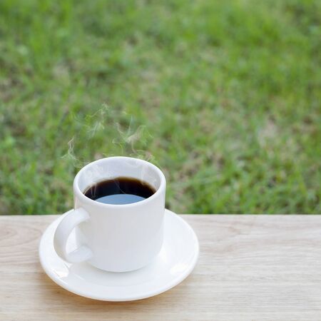 Hot black coffee on wood floorの写真素材