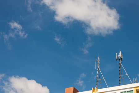 white color antenna repeater tower on blue sky