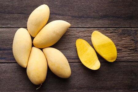 Mango fruit on wood table with top viewの写真素材