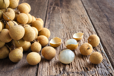longan fruit on wood table brown with copy spaceの写真素材