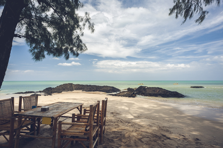 Bamboo table with beach on bright skyの写真素材