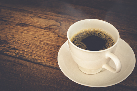 hot coffee on old wooden tableの写真素材