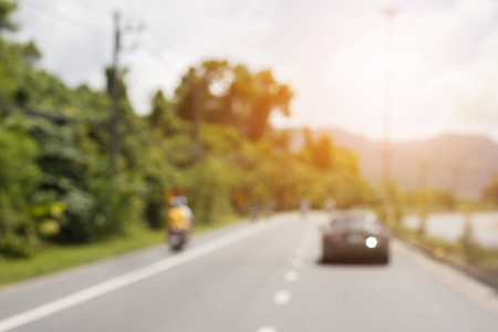 Blur traffic road Highway with bokeh light abstract backgroundの写真素材