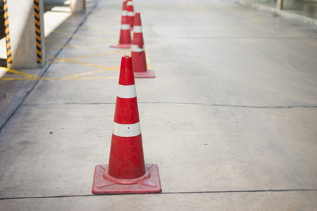 Orange cone placed on the streetの写真素材