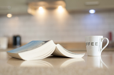 Hot coffee on the table With the book