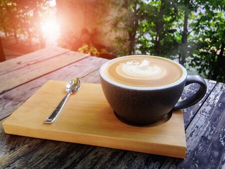 coffee latte in morning with sunlightの写真素材