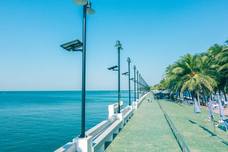 Seaside Blue Clear Sky Background and coconut palm tree beautiful view for relax or promenade.の写真素材