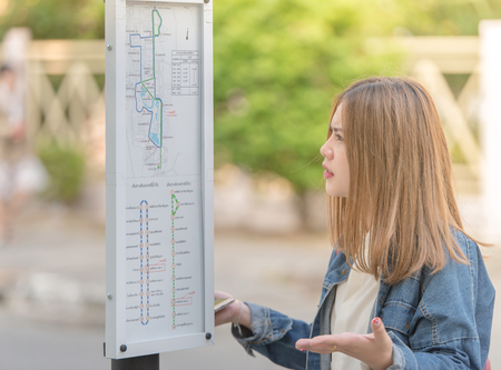she is confused young traveler woman are lost and see guide map
