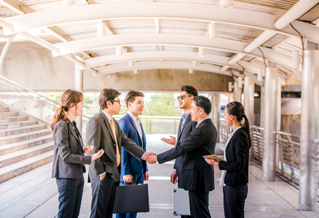 Group of Business people shaking hands,Teamwork finishing up a meetingpartners greeting each other after signing contract and go Seminarの写真素材