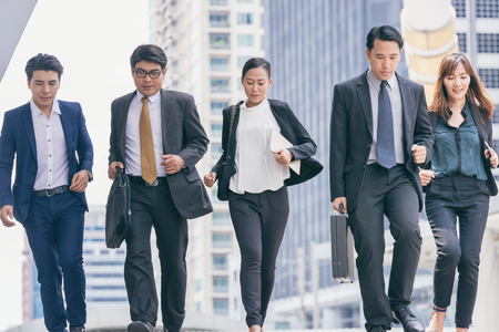Group Business people running in cityの写真素材