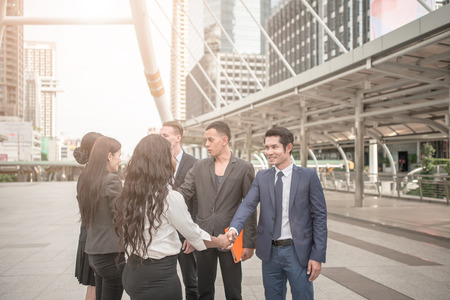 handshake of business People Colleagues Teamwork Meeting .Hold hand and shake hand in cityの写真素材