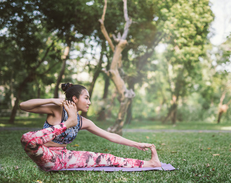Yoga in the park healthy exercise.の写真素材