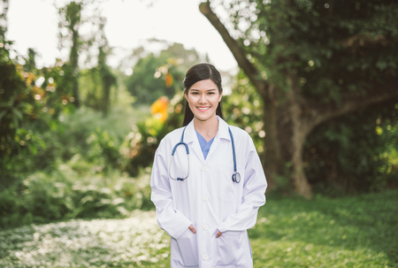 Doctor woman in nature parkの写真素材