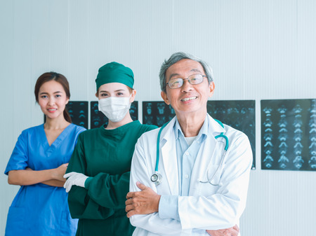 Senior Doctor and Team with nurse and female doctor Surgeon portrait in office at hospitalの写真素材