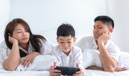 kid addict phone parent unhappyの写真素材