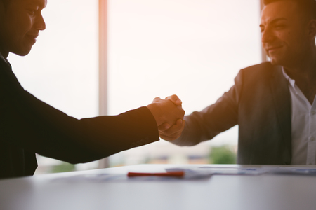 handshake business concept. business people shaking hands in office.の写真素材