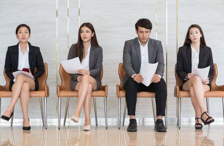 Asian business people are stressed about waiting for a job interview.の写真素材