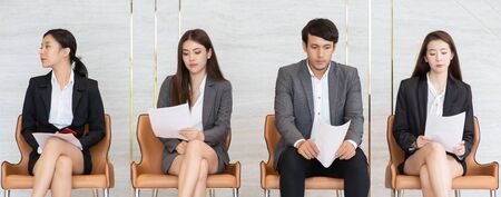 Asian business people are stressed about waiting for a job interview.の写真素材