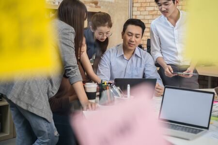 Group of Asian business people team meeting in modern office working design planning and ideas conceptの写真素材