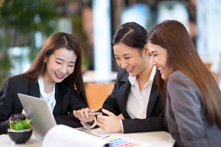 Group of Business woman meeting in a cafe and using laptop.の写真素材